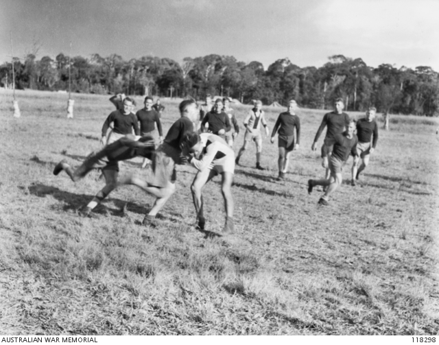 SERIA, BORNEO. 1945-08-30. AN EXCITING MOMENT DURING THE RUGBY LEAGUE ...