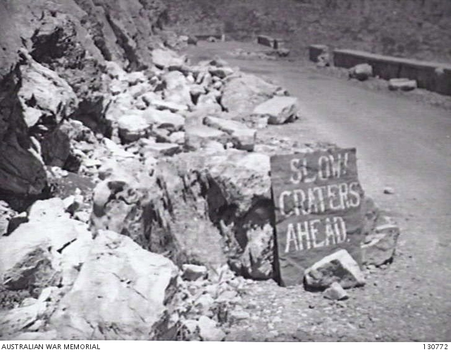 DELPHI, GREECE. 1945-05-05. A ROAD THROUGH THE MOUNTAINS WITH A SIGN ...