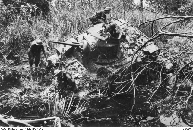 A BOGGED M3 LIGHT GENERAL STUART TANK PRESENTS A DIFFICULT RECOVERY ...