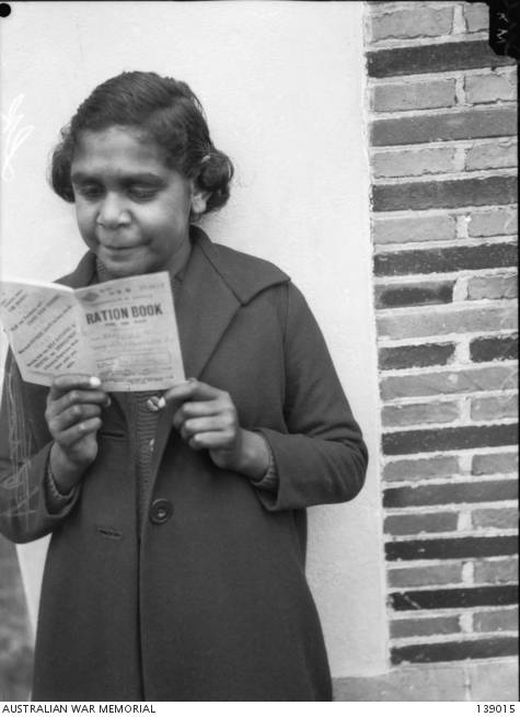 Melbourne, Vic. 1943-06-05. An Australian Aboriginal woman studying her ...
