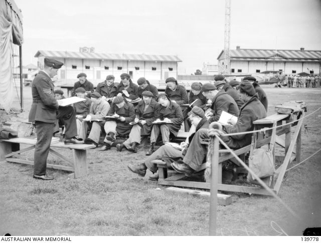 MELBOURNE, VIC. 1943-09-30. A GROUP OF RAAF TRAINEES RECEIVING ...