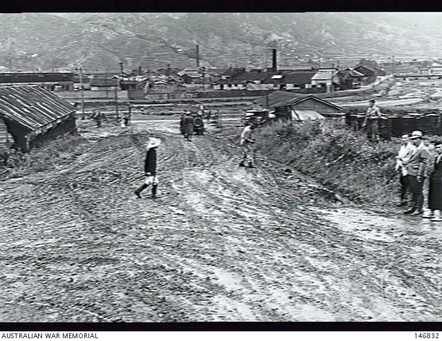 Pusan, Korea. c. 1950-09-26. Looking out of the entrance to the camp ...