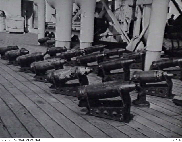 SYDNEY, NSW. 1940-04-01. READY USE 6 INCH SHELLS IN THEIR RACKS ON THE ...