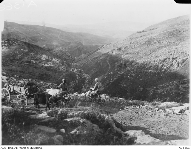 German despatch rider and a local man with his oxen and cart stopped on ...