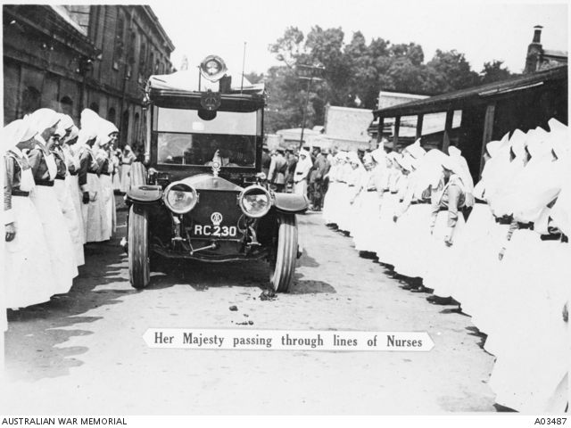 Nurses line the roadside as Her Majesty Queen Mary passes by in a Rolls ...