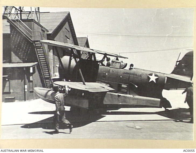 A GRUMMAN AMPHIBIAN OF THE U.S. NAVY SHOWN TAXIING IN THE HANGAR AREA ...