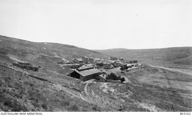 Amman railway station and surrounding buildings. Train carriages can be ...