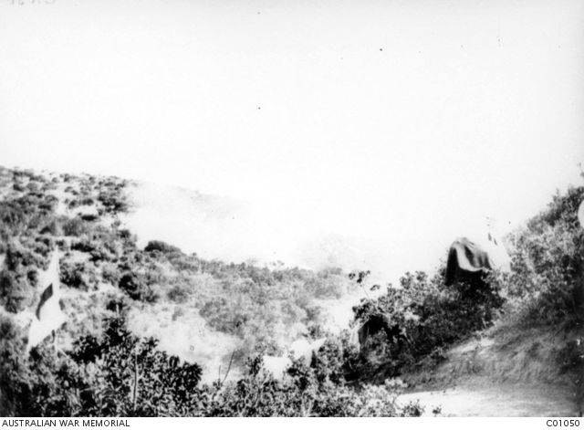 A shell bursting in a gully in the foothills north of Anzac Cove on the ...