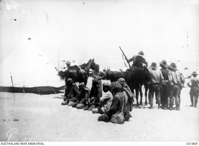 A group of Light Horsemen with six Turkish prisoners they had captured