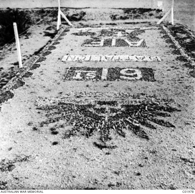A design worked in stone outside 61st Battalion headquarters at a camp ...