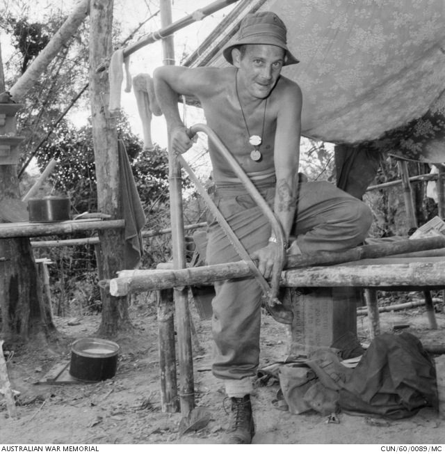 Cutting a piece of bamboo using a bow saw is 6/1180 Sapper Lyle B Davis ...