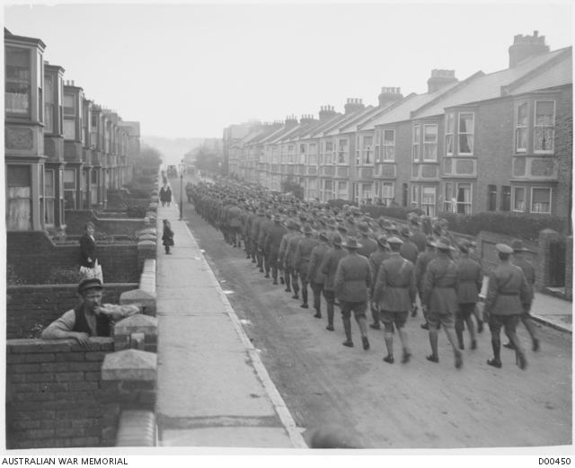 Australian soldiers from Westham camp, marching on the road between two ...