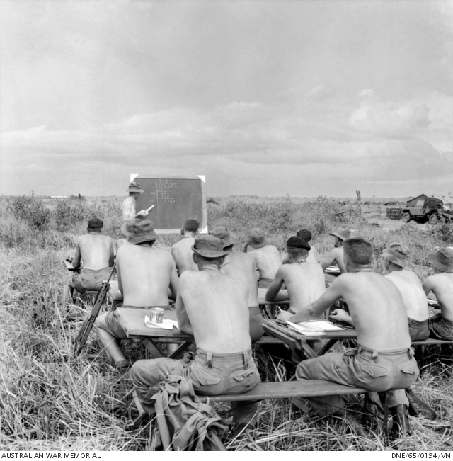 A mathematics class takes place in the outdoors for members of 1st ...