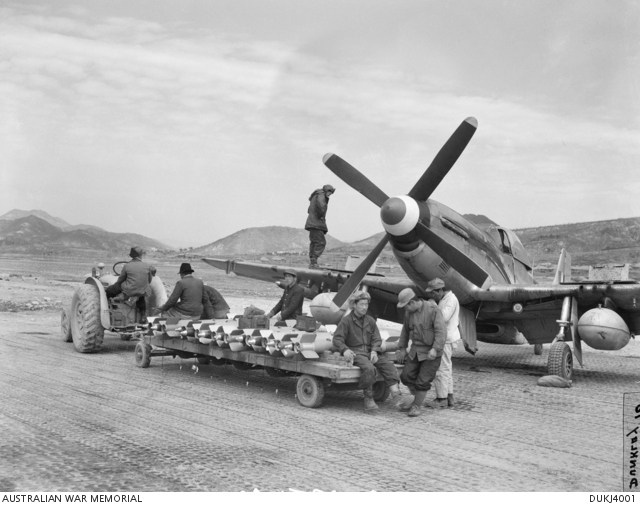 South Korean labourers delivering 5 inch rockets to an unidentified 77 ...