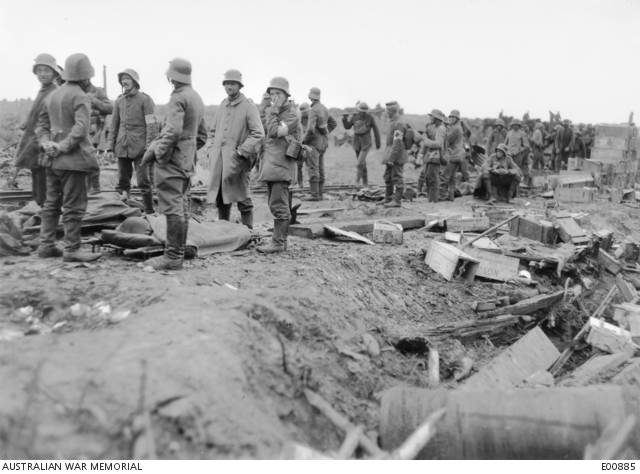 German prisoners assisting to carry in wounded during the battle of ...