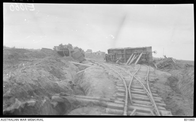 View of the overturned carriages which were the result of a heavy shell ...