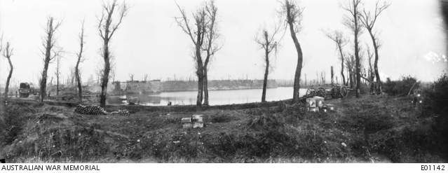 View of the ramparts and moat at Ypres. On the left, a signal motor ...