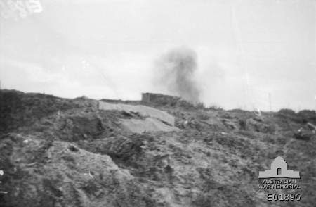 A German shell bursting near a concrete pillbox on Broodseinde Ridge in ...