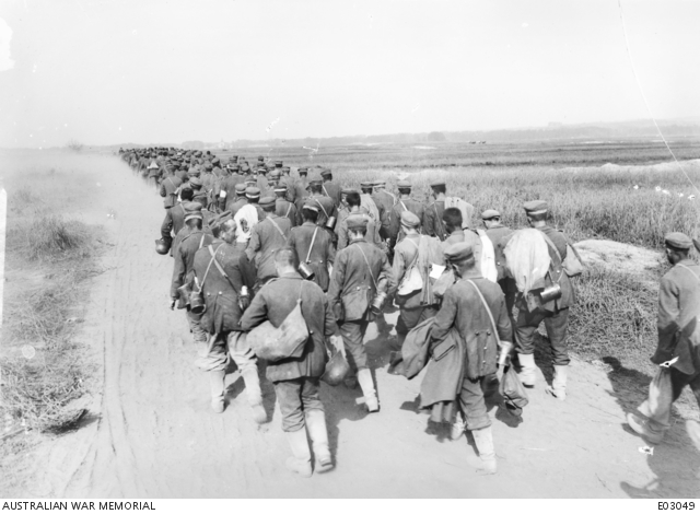 Rear view of a large group of German prisoners, captured by the ...