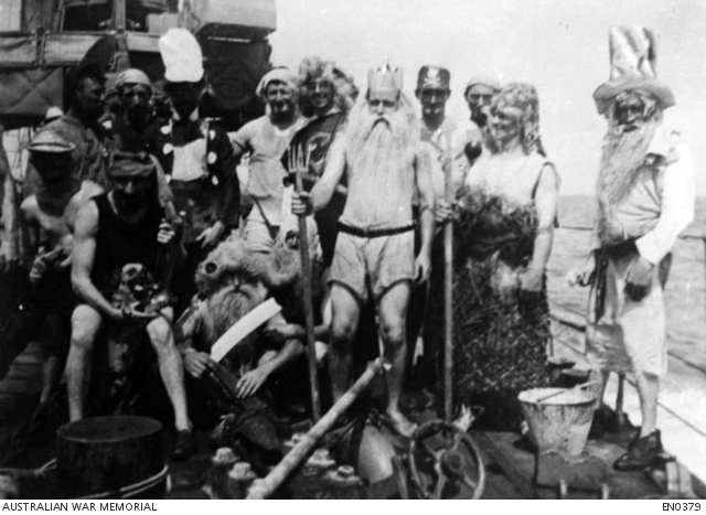 Group portrait of unidentified seamen in fancy dress costume as Father ...