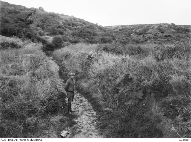 An unidentified member of the Australian Historical Mission standing in ...