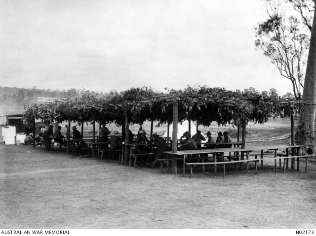 ENOGGERA, QUEENSLAND. C. 1915. A FOLIAGE COVERED DINING STRUCTURE AT ...