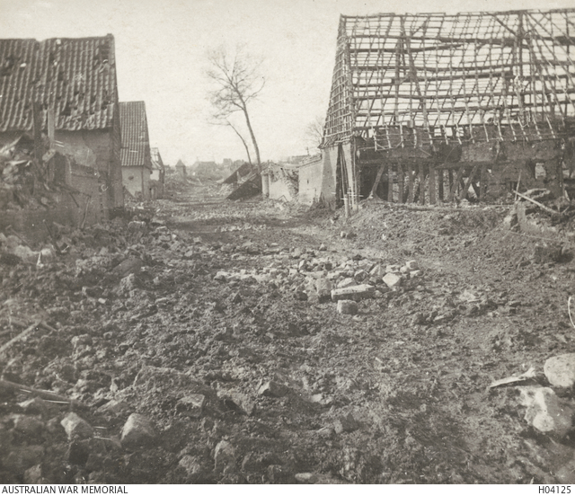 Shell torn village. | Australian War Memorial