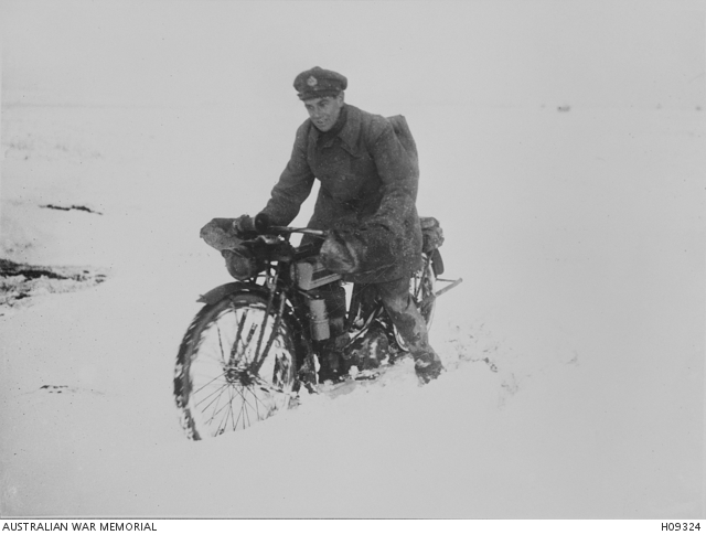 St Pol, France. c. 1918. A British Army despatch rider finding it was ...