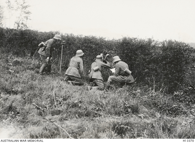 Four German Army soldiers using periscopic binoculars to observe Allied ...