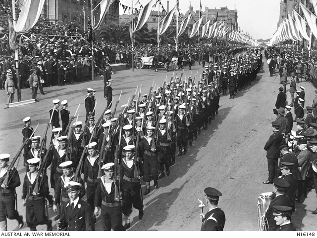 Australian naval personnel marching along a decorated Macquarie Street ...