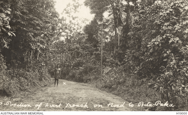 RABAUL, NEW BRITAIN. C. 1914. THE CROSS BESIDE THE LOCAL NATIVE MARKS ...