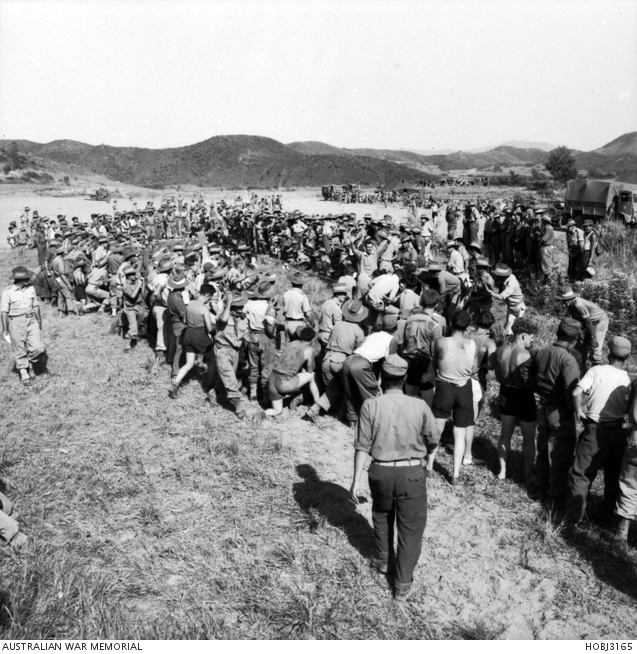 A large crowd of soldiers, probably from the 1st Battalion, The Royal ...