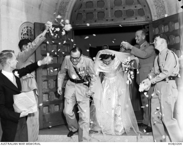 An unidentified army captain and his bride leaving their wedding