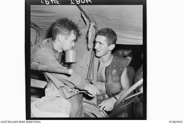 Korea. August 1952. Corporal Max Wilson of Blacktown, NSW, enjoys a cup ...