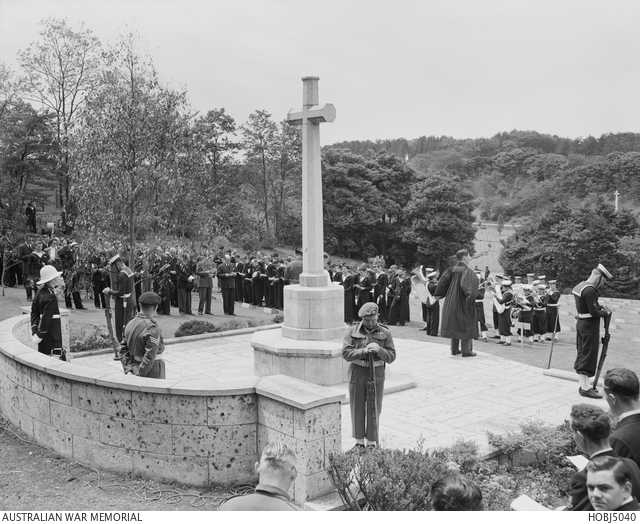 Yokohama, Japan. 25 April 1954. With heads bowed and rifles reversed ...