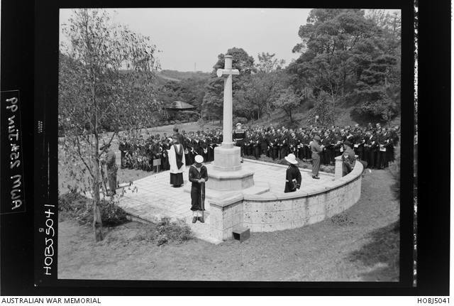 Yokohama, Japan. 25 April 1954. With heads bowed and rifles reversed ...