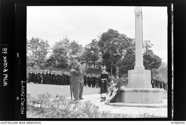 Yokohama, Japan. 25 April 1954. With heads bowed and rifles reversed ...