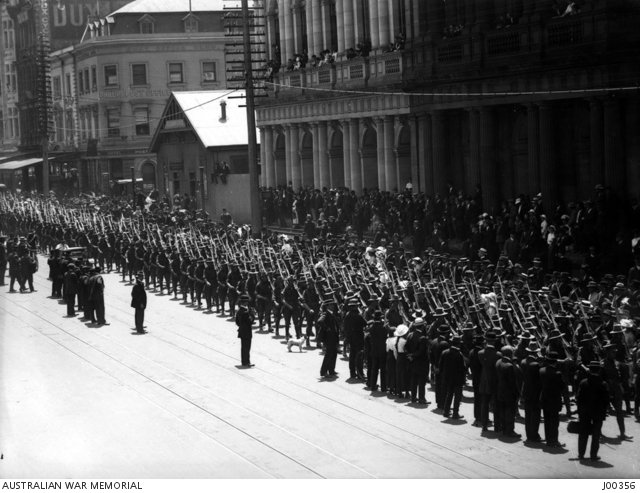 Troops marching through Elizabeth Street in the city, Melbourne, with ...