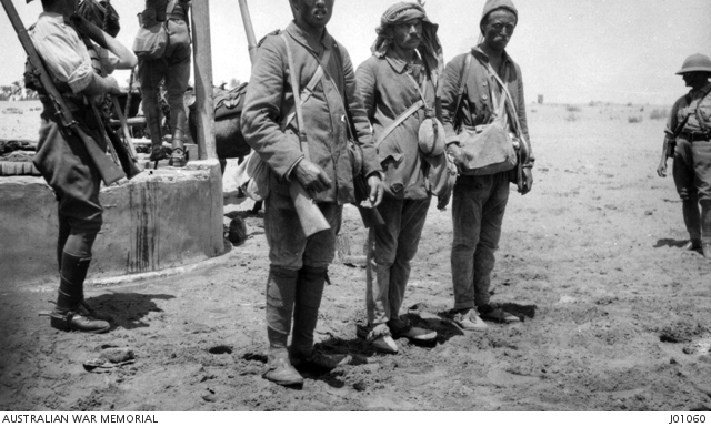 Three prisoners captured by the Australian Light Horse, one prisoner is ...