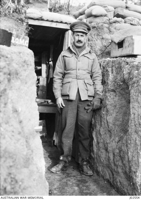 LT.-COL. A.M. MARTYN PHOTOGRAPHED OUTSIDE HIS DUGOUT AT ANZAC IN 1915 ...