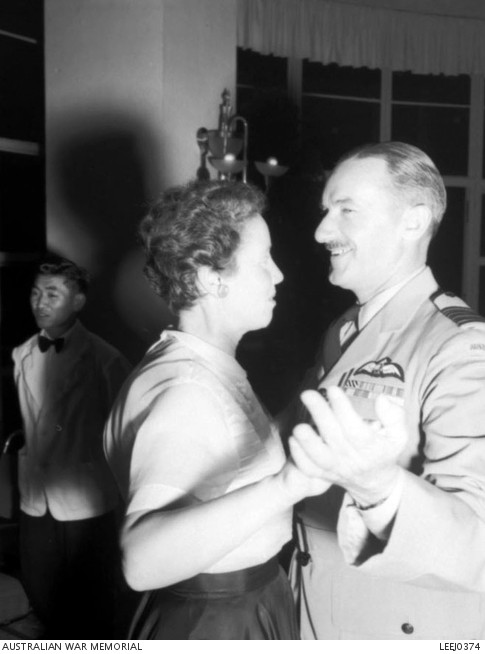 An RAAF group captain and his partner enjoy a dance at a social ...