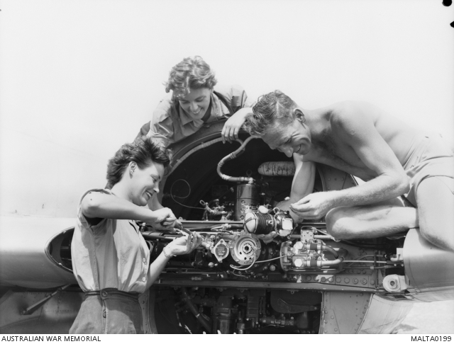 Two members of the Women's Royal Navy Service (WRNS) work on a jet ...