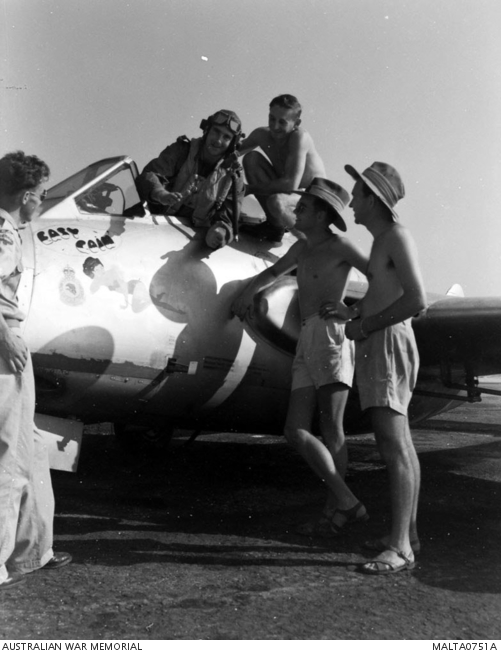 Members of 78 Fighter Wing RAAF admire the insignia painted on the side ...