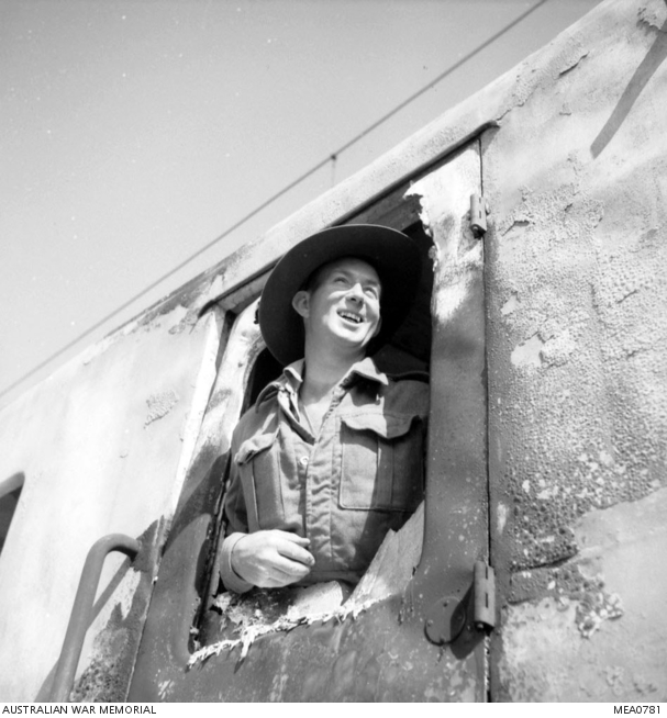 Italy. c. September 1943. Corporal B. Bourke of Bendigo, Vic, who is a ...