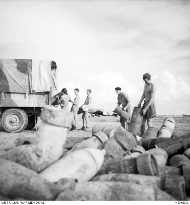 Foggia, Italy. 1943. RAAF members of No. 3 Squadron RAAF, load bombs ...