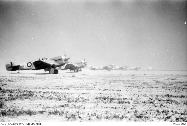 Kairouan, Tunisia. c. 18 April 1943. Line up of Curtiss P40M Kittyhawk ...