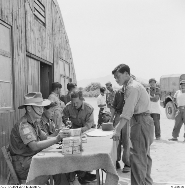 Pay day in Korea. 22543 Warrant Officer Class 2 (WO2) William John