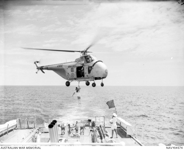 0.1862 Midshipman Derek A Caton is being transferred by helicopter from ...