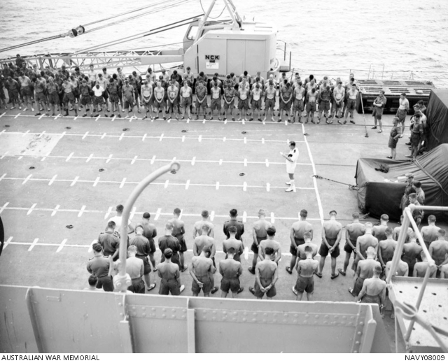 With heads bowed, soldiers of 1 Battalion, The Royal Australian ...