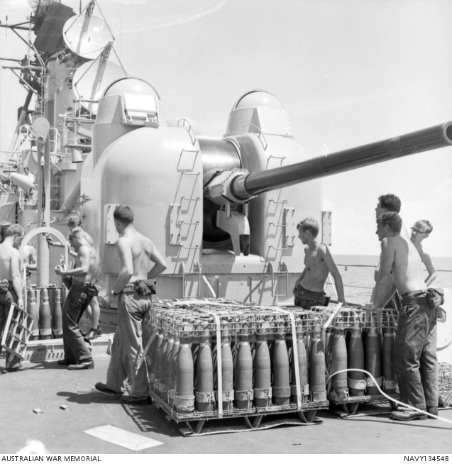 Several unidentified sailors handle palletted ammunition near the Mount ...